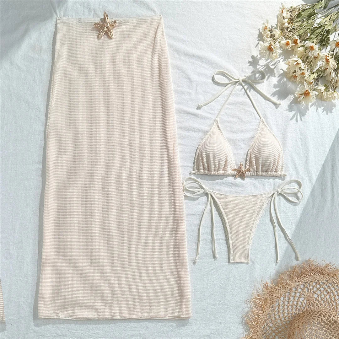 Ropa de playa con biquini y detalle de estrella