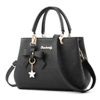 EUTERPE - Bolso Espacioso con Bandolera de Cuero Granulado