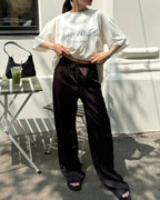 Pantalones anchos de satén de talle alto Norma