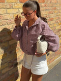 Chaqueta Olivia de cuadros con cordón y cuello alto