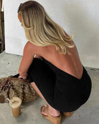 Mono Lucy sin espalda con cuello halter